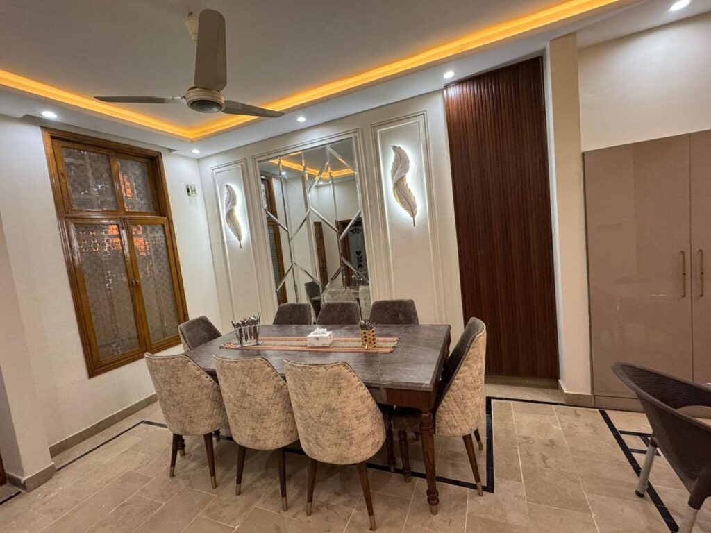Johar Guest House Karachi - entrance hallway with wooden door